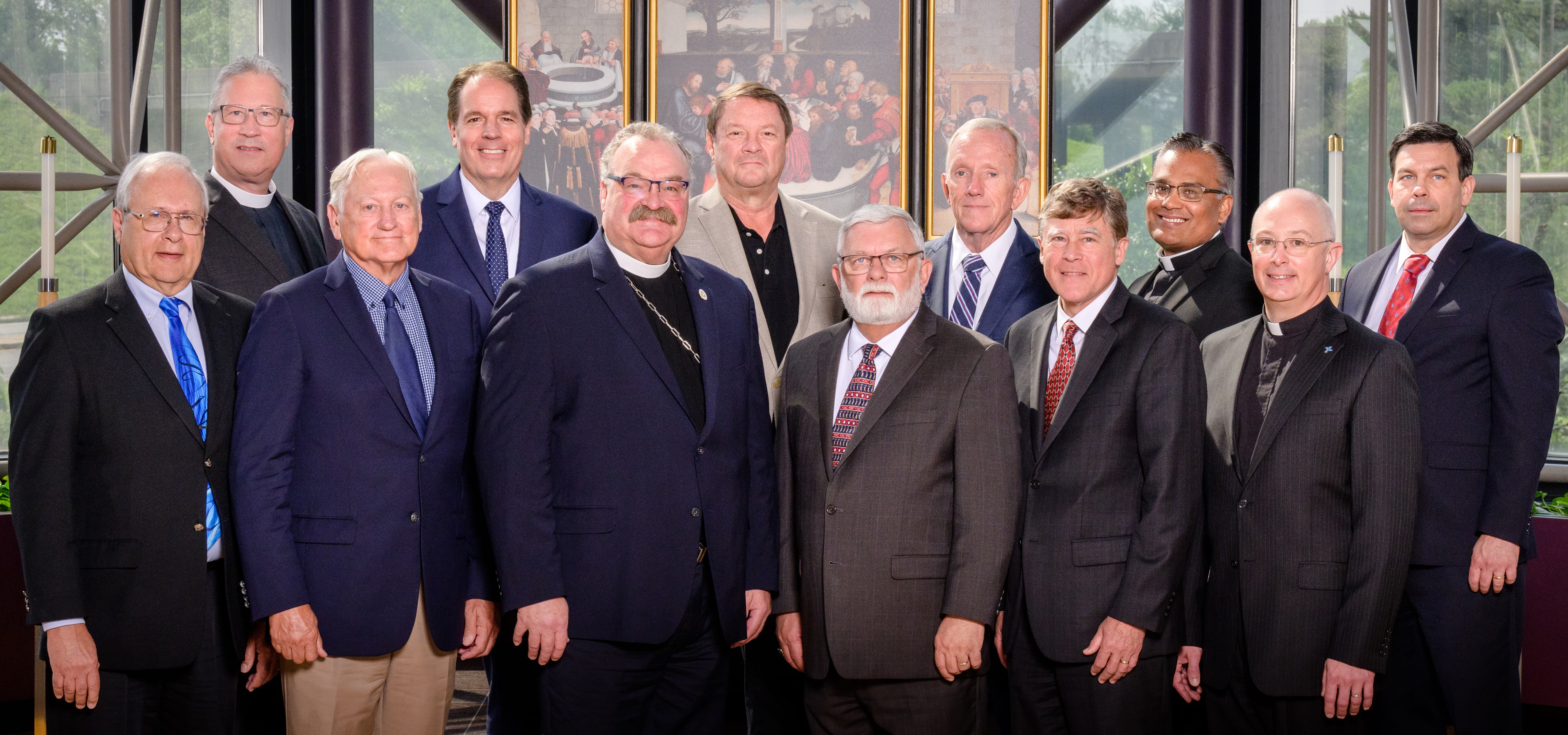 LCMS Board of Directors members Dr. Jesse Yow, Dr. Jan Lohmeyer, Rev. Dr. Matthew C. Harrison, president,  Rev. Dr. Michael Kumm, chairman, Mr. Christian Preus, Rev. Dr. John Sias, secretary; Rev. Peter Lange, first vice-president; Mr. Rick Stathakis, Mr. Ed Everts, Mr. Larry Harrington, Rev. Josemon Hoem, Mr. Andrew Grams. Missing: Mr. Keith Frndak.