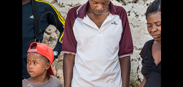 Residents pray on Wednesday, Oct. 12, 2016, at a home in Duchity, Haiti. LCMS Communications/Erik M. Lunsford