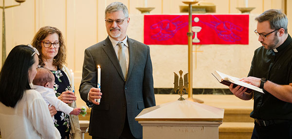 Lutherans Engage the World - Baptized into Christ - A mother and baby from Redeeming Life Outreach Ministries' maternity home in East Dundee, Illinois, join God's family through the waters of Holy Baptism.
