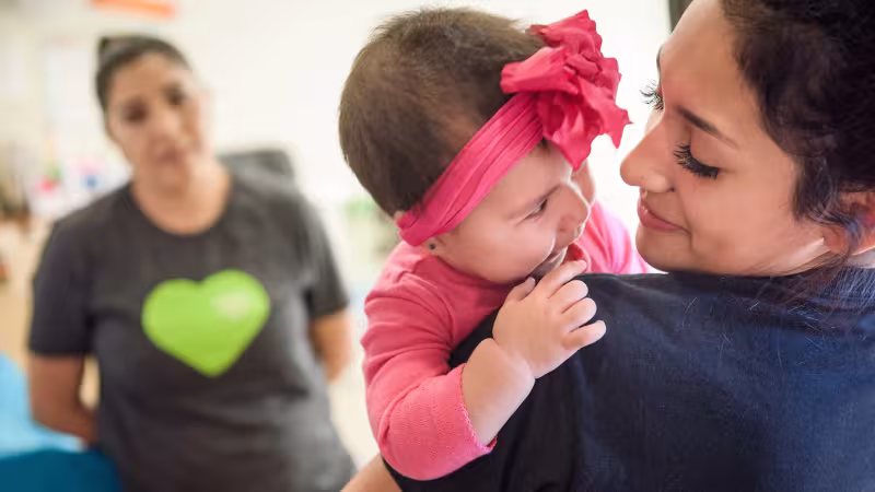 Woman holding a baby